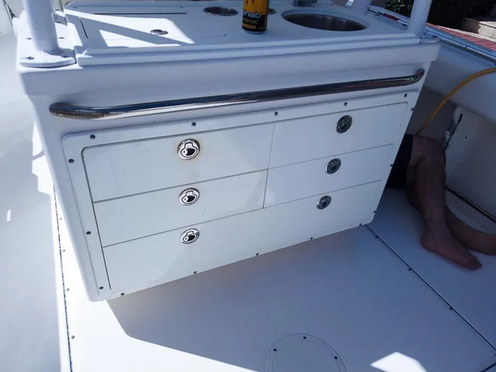  Yacht Photos Pics 2015 Edgewater 320CC boat interior with storage drawers and sink.