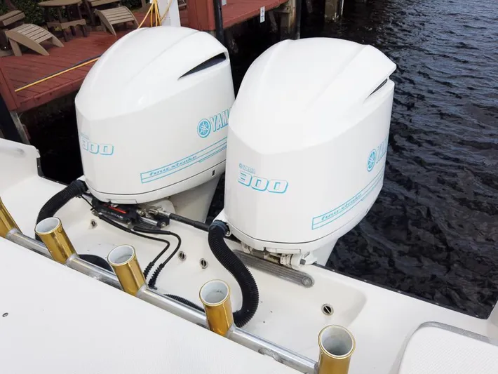  Yacht Photos Pics Twin Yamaha 300 outboard engines on a 2015 Edgewater 320CC boat by the dock.