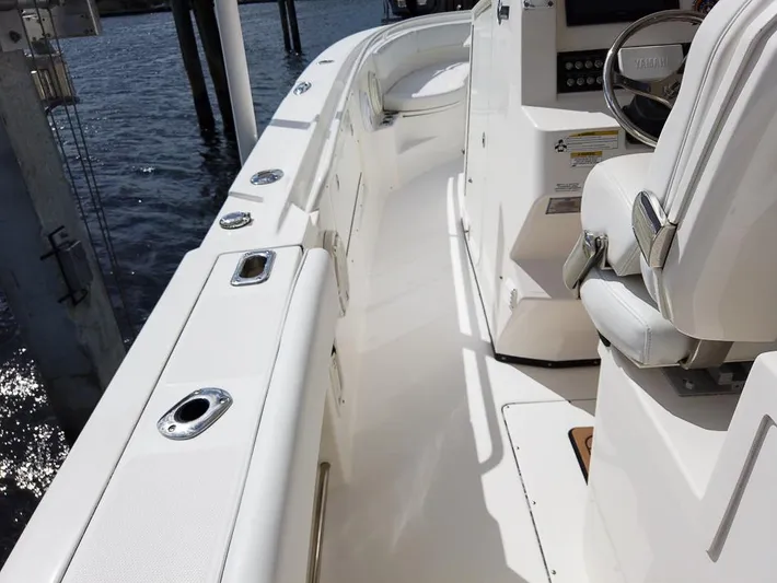  Yacht Photos Pics 2015 Edgewater 320CC boat interior with white seating and control panel.