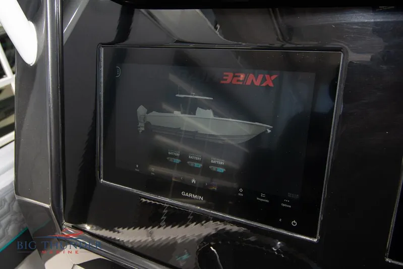  Yacht Photos Pics Garmin display on 2022 Fountain 32 NX boat dashboard showing vessel information.