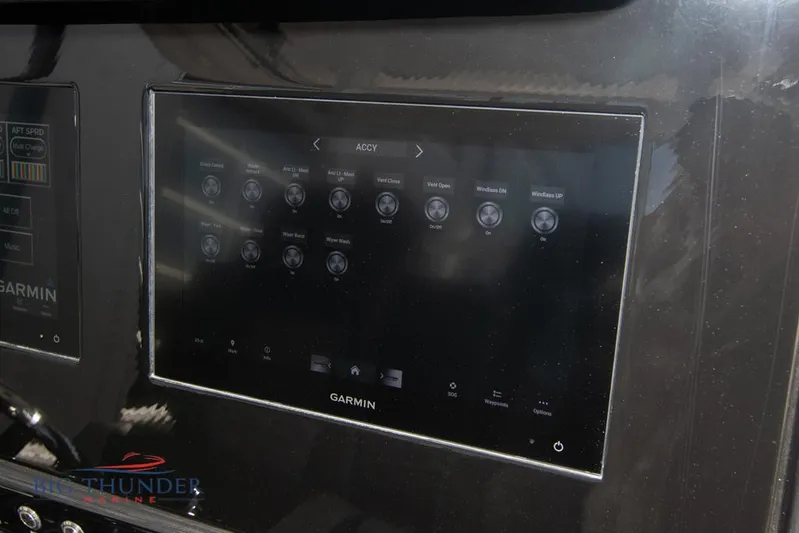  Yacht Photos Pics Touchscreen control panel on a 2022 Fountain 32 NX boat, featuring Garmin interface.