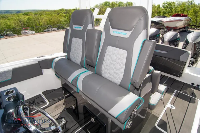  Yacht Photos Pics 2022 Fountain 32 NX boat interior with stylish gray seating and modern design.