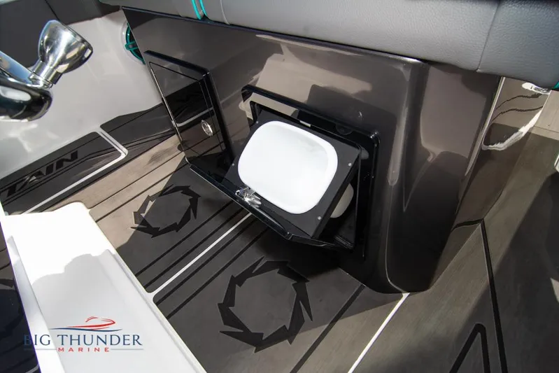  Yacht Photos Pics 2022 Fountain 32 NX boat interior with storage compartment and sleek design.