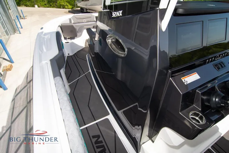  Yacht Photos Pics 2022 Fountain 32 NX boat interior with sleek design and modern dashboard.