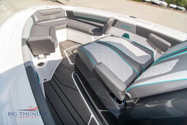  Yacht Photos Pics 2022 Fountain 32 NX boat interior with gray seating and teal accents at Big Thunder Marine.