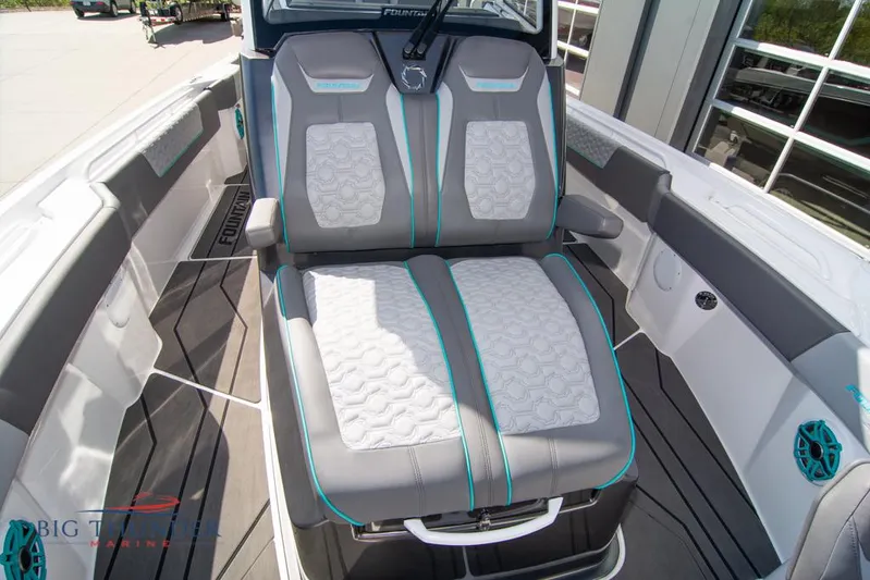  Yacht Photos Pics 2022 Fountain 32 NX boat interior with stylish gray and white seating, featuring turquoise accents.