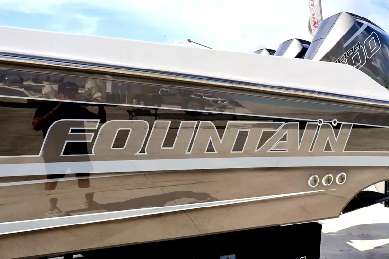  Yacht Photos Pics 2022 Fountain 32 NX boat with reflective exterior and visible branding.