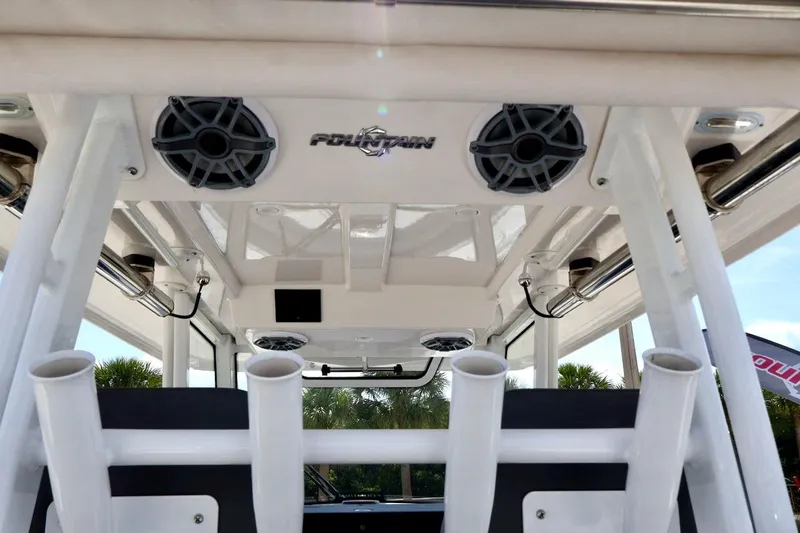  Yacht Photos Pics 2022 Fountain 32 NX boat interior with speakers and rod holders.