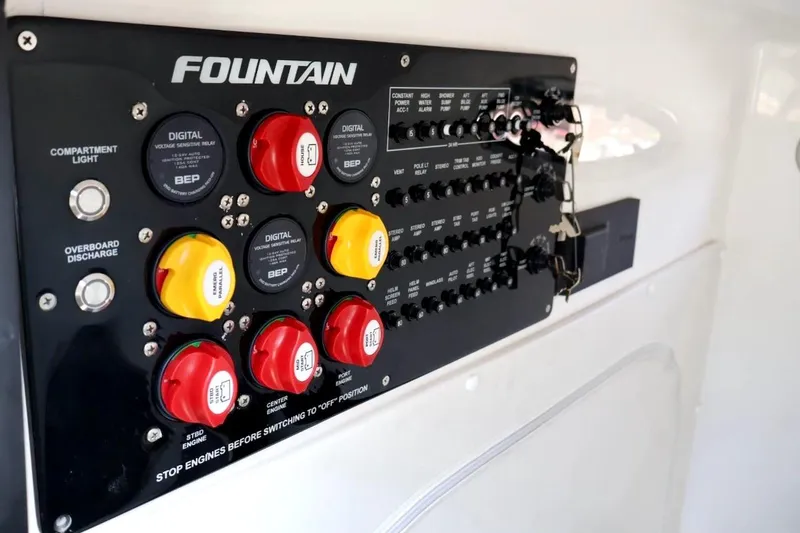  Yacht Photos Pics Control panel of 2022 Fountain 32 NX boat with switches and digital displays.