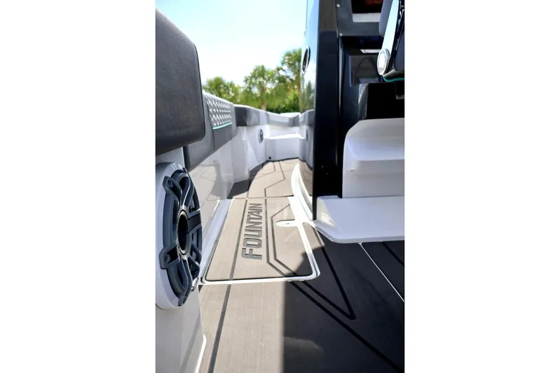  Yacht Photos Pics 2022 Fountain 32 NX boat deck with branded mat and speaker detail.