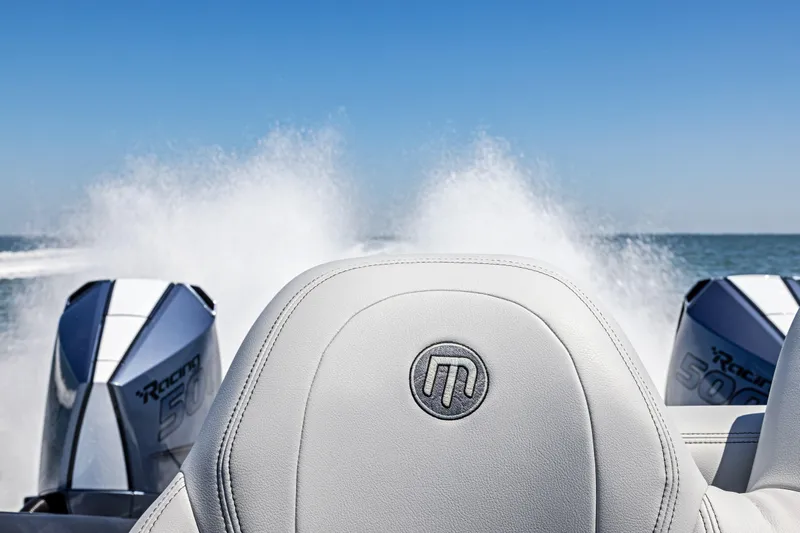  Yacht Photos Pics 2026 Mystic Powerboats C4000 racing on open water, showcasing powerful engines.