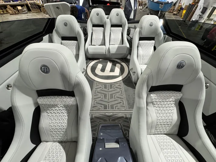  Yacht Photos Pics Luxurious interior of 2026 Mystic Powerboats C4000 with stylish white seating.