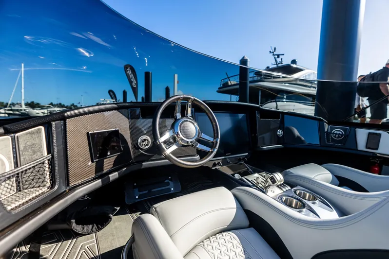  Yacht Photos Pics Luxurious cockpit of 2026 Mystic Powerboats C4000 with sleek design and advanced controls.