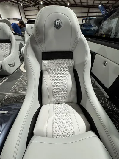  Yacht Photos Pics Luxurious interior seat of 2026 Mystic Powerboats C4000 with intricate stitching design.