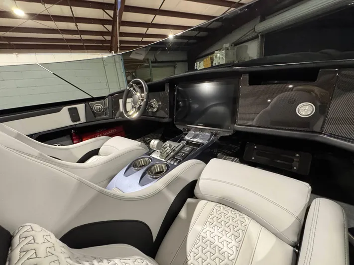  Yacht Photos Pics Interior of 2026 Mystic Powerboats C4000, featuring modern dashboard and luxurious seating.