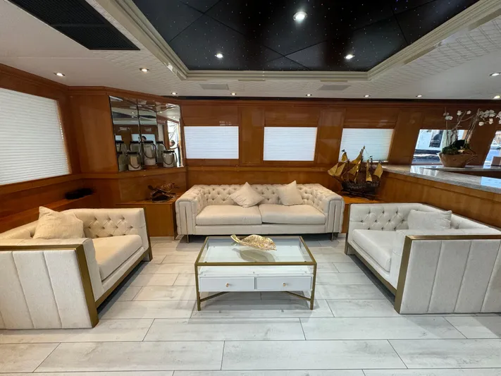  Yacht Photos Pics Luxurious yacht interior with elegant seating, glass table, and nautical decor on Baglietto 116, 2000 model.