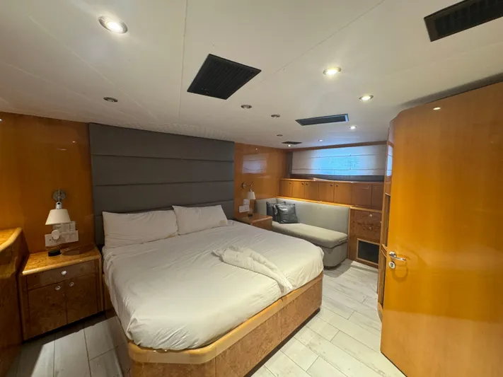  Yacht Photos Pics Luxurious bedroom interior of 2000 Baglietto 116 yacht with modern furnishings.