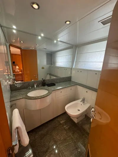  Yacht Photos Pics Luxurious bathroom on 2000 Baglietto 116 yacht with modern fixtures and elegant design.
