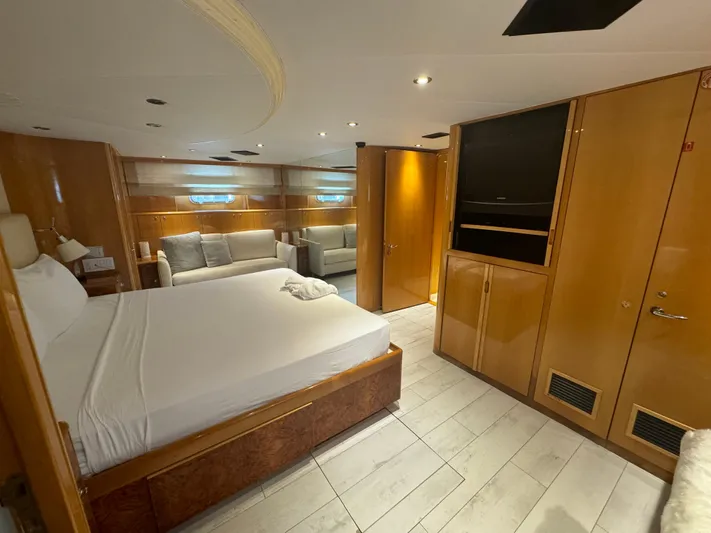  Yacht Photos Pics Luxurious bedroom interior of 2000 Baglietto 116 yacht with modern furnishings.