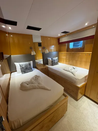  Yacht Photos Pics Luxurious twin cabin on 2000 Baglietto 116 yacht with modern wood finishes.