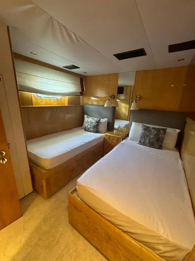  Yacht Photos Pics Luxurious twin bedroom on 2000 Baglietto 116 yacht with modern wood finishes.