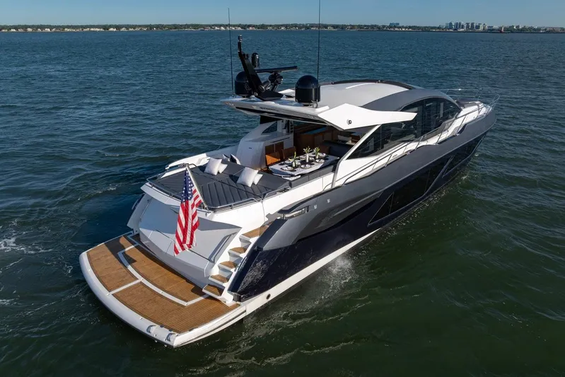 Kb Jr Yacht Photos Pics 2020 Sunseeker Predator 74 yacht cruising on open water, rear view.
