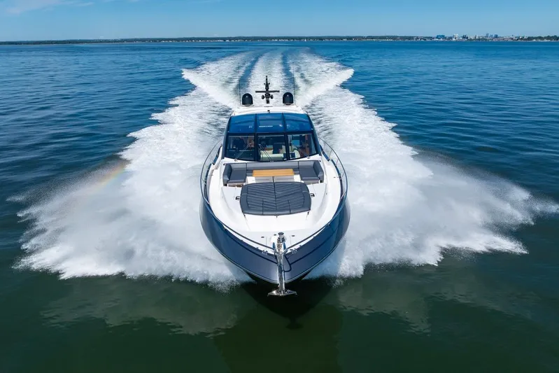 Kb Jr Yacht Photos Pics 2020 Sunseeker Predator 74 yacht cruising on open water, creating a dynamic wake.
