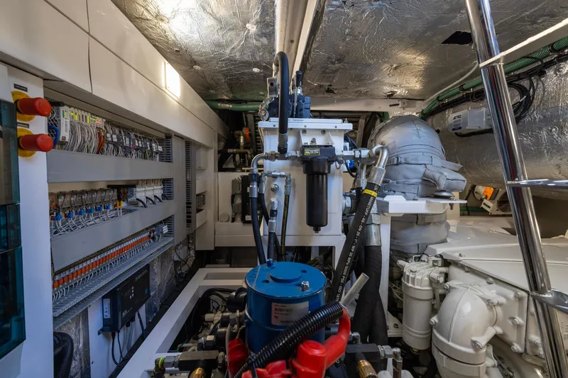 Kb Jr Yacht Photos Pics Engine room of 2020 Sunseeker Predator 74 yacht, showcasing complex machinery and wiring.