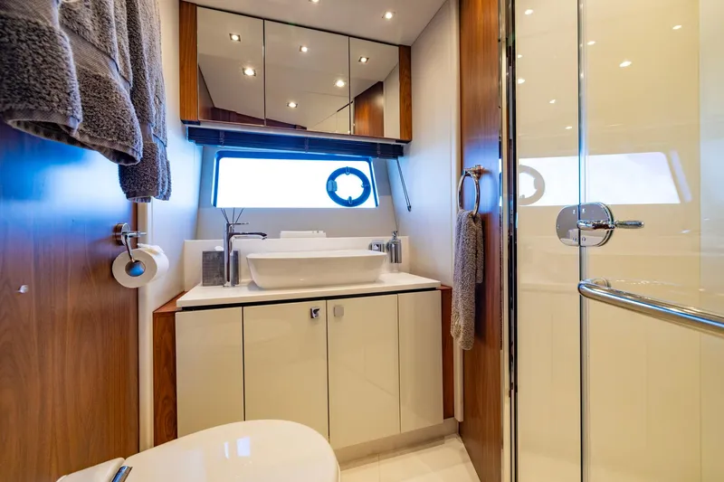 Kb Jr Yacht Photos Pics Luxurious bathroom on 2020 Sunseeker Predator 74 yacht with modern fixtures and elegant design.