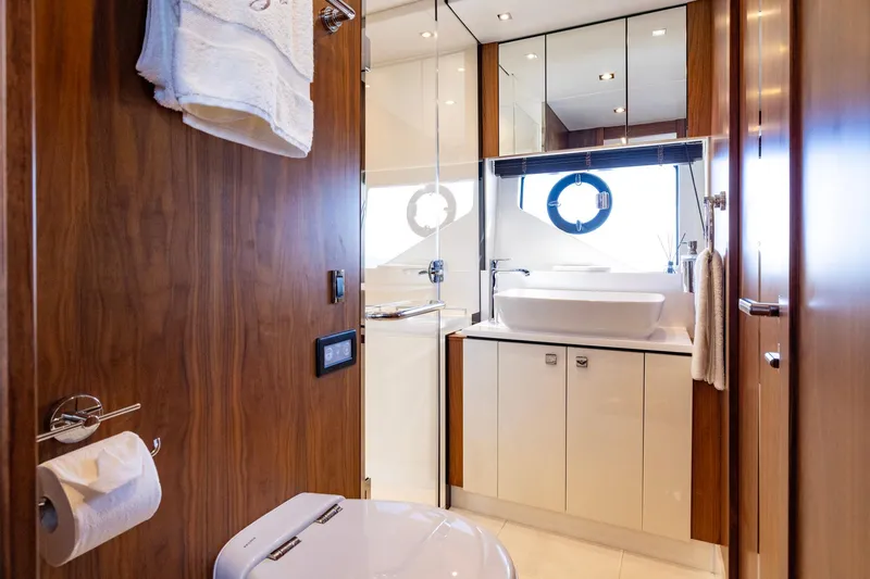 Kb Jr Yacht Photos Pics Luxurious bathroom interior on 2020 Sunseeker Predator 74 yacht, featuring modern fixtures and wood accents.