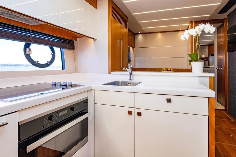 Kb Jr Yacht Photos Pics Luxurious kitchen interior of 2020 Sunseeker Predator 74 yacht with modern appliances.