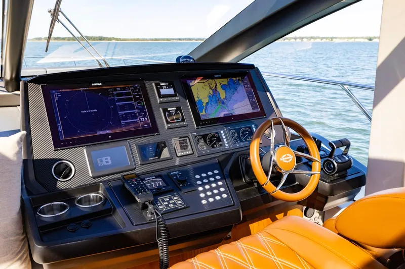 Kb Jr Yacht Photos Pics Cockpit of 2020 Sunseeker Predator 74 yacht with advanced navigation systems and leather steering wheel.