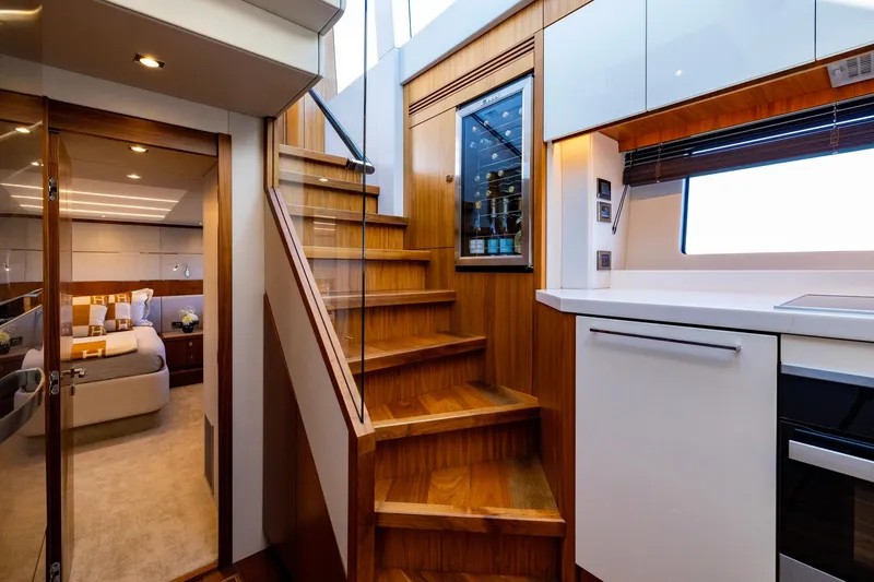 Kb Jr Yacht Photos Pics Luxurious interior of 2020 Sunseeker Predator 74 yacht with modern kitchen and cozy bedroom.