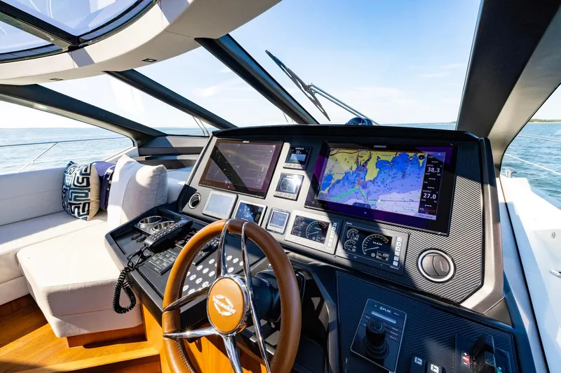 Kb Jr Yacht Photos Pics Cockpit of 2020 Sunseeker Predator 74 yacht with navigation screens and steering wheel.