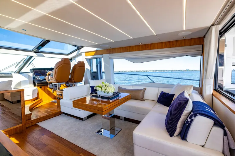 Kb Jr Yacht Photos Pics Luxurious interior of 2020 Sunseeker Predator 74 yacht with elegant seating and panoramic windows.