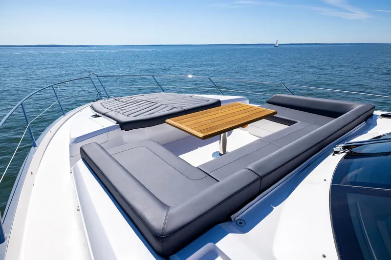 Kb Jr Yacht Photos Pics Luxurious Sunseeker Predator 74 yacht deck with seating, table, and ocean view, 2020 model.