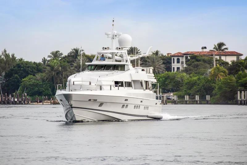  Yacht Photos Pics Oceanfast 1989 Motor Yacht cruising near a tropical shoreline.