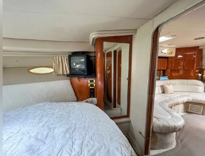 Adagio Yacht Photos Pics Interior of 1999 Sea Ray 380 Sundancer yacht with cozy bedroom and living area.