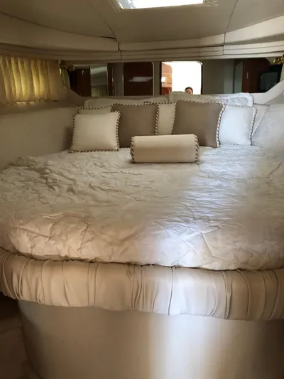 Adagio Yacht Photos Pics Luxurious cabin interior of 1999 Sea Ray 380 Sundancer with plush bedding and pillows.