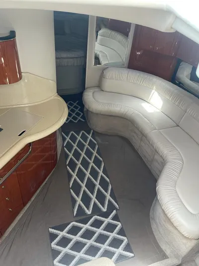 Adagio Yacht Photos Pics Interior of 1999 Sea Ray 380 Sundancer with white seating and modern design.