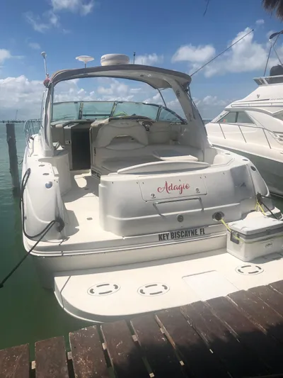 Adagio Yacht Photos Pics 1999 Sea Ray 380 Sundancer docked in Key Biscayne, Florida, under a clear blue sky.