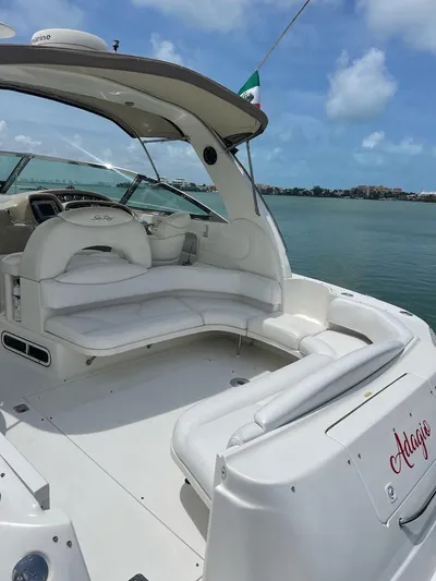 Adagio Yacht Photos Pics 1999 Sea Ray 380 Sundancer yacht with white seating, docked on a sunny day.