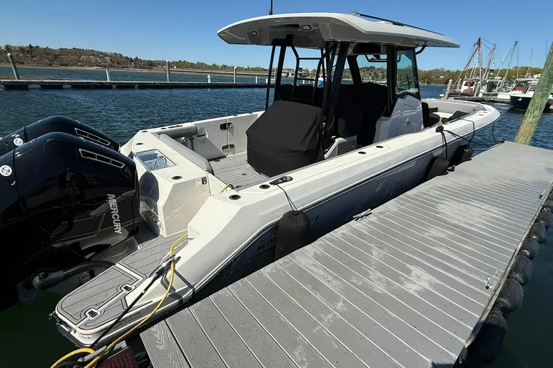 Ghost Rider Yacht Photos Pics 2024 Boston Whaler 360 Outrage docked, featuring sleek design and powerful Mercury engines.