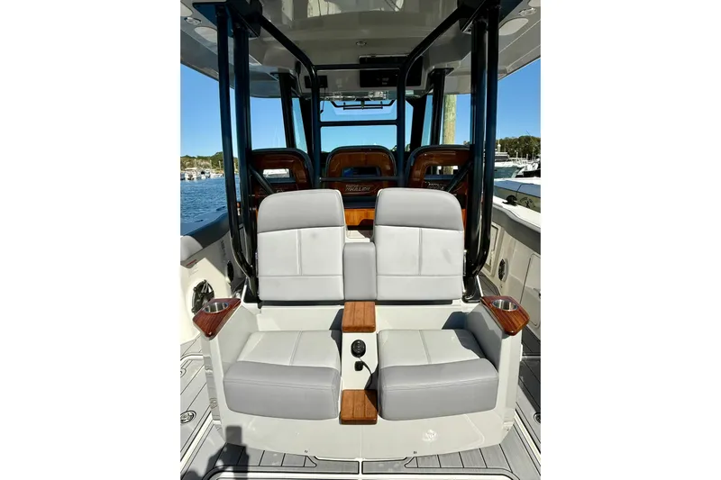 Ghost Rider Yacht Photos Pics 2024 Boston Whaler 360 Outrage interior with luxurious seating and sleek design.