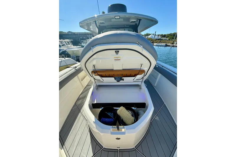 Ghost Rider Yacht Photos Pics 2024 Boston Whaler 360 Outrage boat storage compartment open at marina.