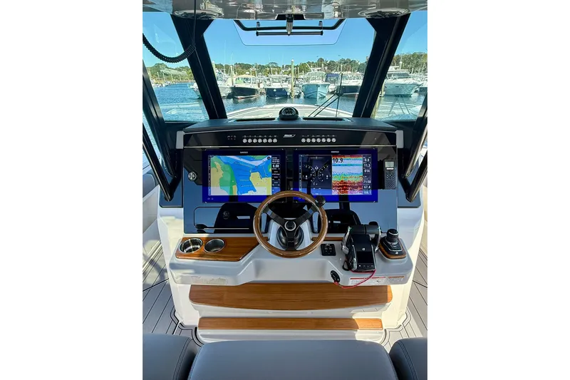 Ghost Rider Yacht Photos Pics 2024 Boston Whaler 360 Outrage helm with advanced navigation displays and controls.