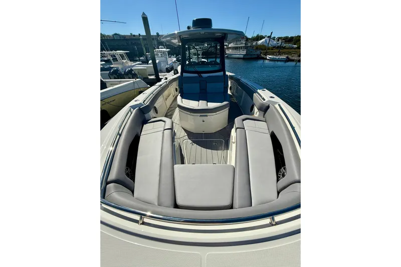 Ghost Rider Yacht Photos Pics 2024 Boston Whaler 360 Outrage boat with spacious seating at the dock.