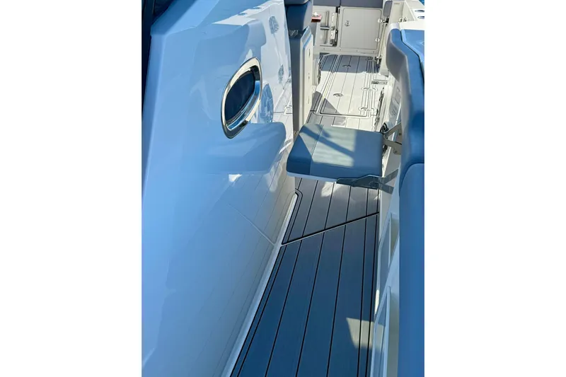 Ghost Rider Yacht Photos Pics 2024 Boston Whaler 360 Outrage boat interior with sleek seating and modern design.