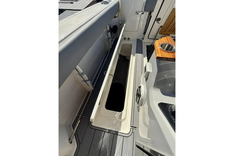 Ghost Rider Yacht Photos Pics 2024 Boston Whaler 360 Outrage boat interior storage compartment with sleek design.