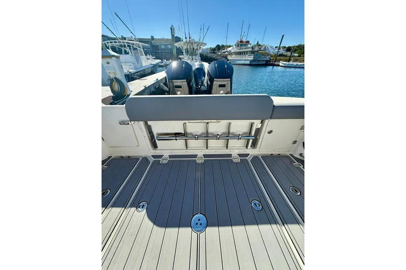 Ghost Rider Yacht Photos Pics 2024 Boston Whaler 360 Outrage boat deck with dual engines at marina.